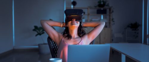 Smiling business female using virtual reality goggles distance learning and executive education for business