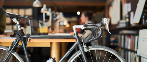 Detail of a bicycle parked in a new business office.