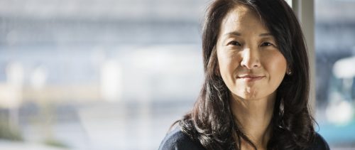 Businesswoman standing in the office of the window female leader woman asian