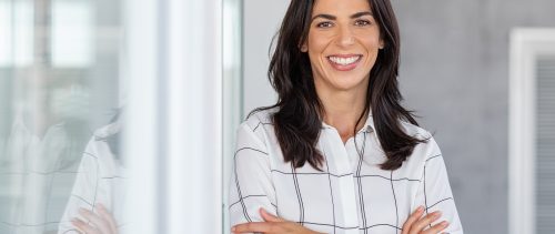 Successful mature business woman looking at camera