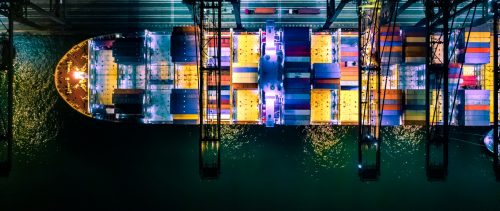 Container ship in import export and business logistic, International transportation, Business logistics concept,Night view, Hong Kong