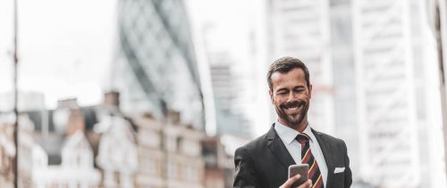 Businessman calling taxi for airport drop off