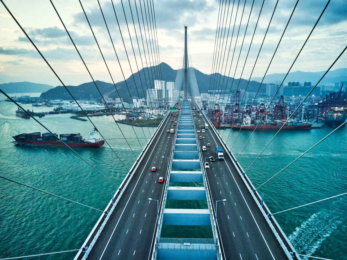 Bridge in Hong Kong and Container Cargo freight ship