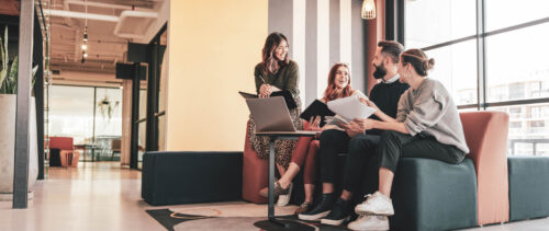 Multicultural businesspeople working in an office lobby