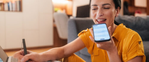 Woman using a chatbot for assistance at home